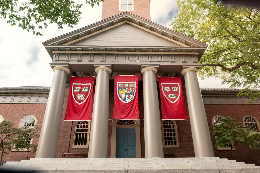 Harvard University building with banners, featured by Opus College Prep.